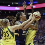 Phoenix Mercury center Brittney Griner (42) is guarded by Seattle Storm's Sami Whitcomb (33) and Natasha Howard as she tries to drive to the basket during the first half of Game 4 of a WNBA basketball semifinals playoff game, Sunday, Sept. 2, 2018, in Phoenix. (AP Photo/Ralph Freso)
