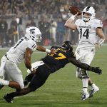 Michigan State quarterback Brian Lewerke (14) gets off a pass as he is pressured by Arizona State linebacker Darien Butler (37) as Michigan State running back Connor Heyward (11) tries to make a block during the first half of an NCAA college football game Saturday, Sept. 8, 2018, in Tempe, Ariz. (AP Photo/Ross D. Franklin)