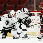 Arizona Coyotes right wing Richard Panik (14) scores a goal as he sends the puck past Los Angeles Kings defenseman Paul LaDue (38) and goalie Jack Campbell, left, during the first period of an NHL preseason hockey game Tuesday, Sept. 18, 2018, in Glendale, Ariz. (AP Photo/Ross D. Franklin)