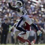 Los Angeles Rams wide receiver Brandin Cooks catches a pass over Arizona Cardinals defensive back Budda Baker during the second half of an NFL football game Sunday, Sept. 16, 2018, in Los Angeles. (AP Photo/Marcio Jose Sanchez)