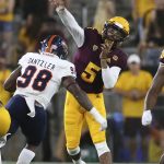 Arizona State quarterback Manny Wilkins (5) throws a pass as he is pressured by UTSA defensive end Lorenzo Dantzler during the second half of an NCAA college football game, Saturday, Sept. 1, 2018, in Tempe, Ariz. (AP Photo/Ralph Freso)