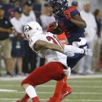 Arizona wide receiver Shun Brown (6) sidesteps the tackle of Southern Utah safety Mike Sims in the second half during an NCAA college football game, Saturday, Sept. 15, 2018, in Tucson, Ariz. (AP Photo/Rick Scuteri)