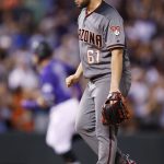 Arizona Diamondbacks relief pitcher Silvino Bracho, reacts after giving up a three-run home run to Colorado Rockies' Trevor Story, back, in the fifth inning of a baseball game Monday, Sept. 10, 2018, in Denver. (AP Photo/David Zalubowski)