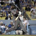 Arizona Diamondbacks' Christian Walker hits a solo home run in the sixth inning of a baseball game against the Los Angeles Dodgers, Saturday, Sept. 1, 2018, in Los Angeles. (AP Photo/Michael Owen Baker)