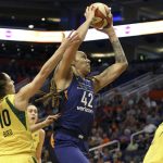 Phoenix Mercury center Brittney Griner (42) drives to the basket between Seattle Storm's Sue Bird (10) and Natasha Howard during the first half of Game 4 of a WNBA basketball playoff semifinal Sunday, Sept. 2, 2018, in Phoenix. (AP Photo/Ralph Freso)