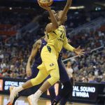 Seattle Storm guard Jordin Canada (21) drives to the basket as Phoenix Mercury forward DeWanna Bonner defends during the second half of Game 4 of a WNBA basketball playoffs semifinal Sunday, Sept. 2, 2018, in Phoenix. (AP Photo/Ralph Freso)