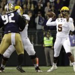 Arizona State quarterback Manny Wilkins (5) looks to pass the ball as Washington defensive lineman Jaylen Johnson (92) is blocked by Arizona State offensive lineman Cohl Cabral during the first half of an NCAA college football game Saturday, Sept. 22, 2018, in Seattle. (AP Photo/Ted S. Warren)