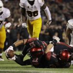 San Diego State running back Chase Jasmin, below left, reaches the ball over the goal line for a touchdown during the second half of an NCAA college football game against Arizona State Saturday, Sept. 15, 2018, in San Diego. San Diego State won 28-21. (AP Photo/Gregory Bull)