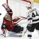 Arizona Coyotes goaltender Antti Raanta (32) makes a sliding glove save as Los Angeles Kings center Nate Thompson (44) waits for a possible rebound during the second period of an NHL preseason hockey game Tuesday, Sept. 18, 2018, in Glendale, Ariz. (AP Photo/Ross D. Franklin)