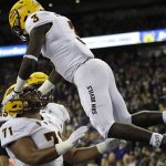 Arizona State running back Eno Benjamin (3) is tossed in the air by offensive lineman Steven Miller (71) after Benjamin scored a touchdown during the first half of an NCAA college football game against Washington, Saturday, Sept. 22, 2018, in Seattle. (AP Photo/Ted S. Warren)