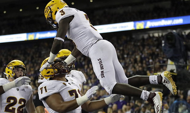 Arizona State running back Eno Benjamin (3) is tossed in the air by offensive lineman Steven Miller...