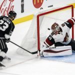 Los Angeles Kings forward Dustin Brown (23) scores on Arizona Coyotes goalie Darcy Kuemper (35) during the third period of a preseason NHL hockey game Tuesday, Sept. 18, 2018, in Los Angeles. (AP Photo/Ringo H.W. Chiu)