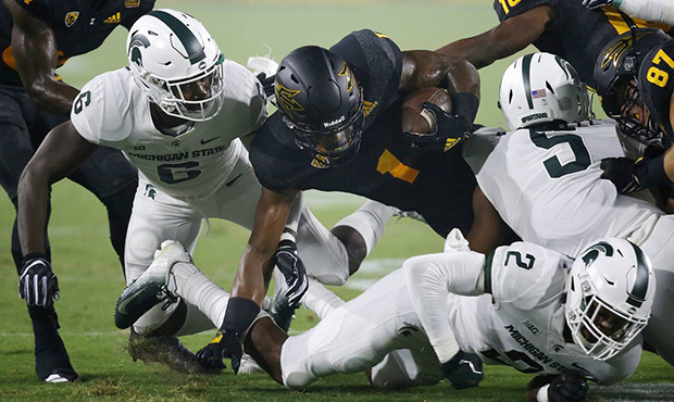 Arizona State wide receiver N'Keal Harry (1) is taken down by Michigan State safety David Dowell (6...