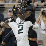 Arizona State wide receiver N'Keal Harry (1) makes a catch over Michigan State cornerback Justin Layne (2) before diving into the end zone for a touchdown during the second half of an NCAA college football game Saturday, Sept. 8, 2018, in Tempe, Ariz. Arizona State defeated Michigan State 16-13. (AP Photo/Ross D. Franklin)
