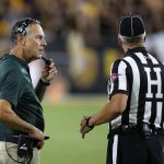 Michigan State head coach Mark Dantonio, left, calls a timeout as he talks with an official during the second half of an NCAA college football game against Arizona State Saturday, Sept. 8, 2018, in Tempe, Ariz. Arizona State defeated Michigan State 16-13. (AP Photo/Ross D. Franklin)