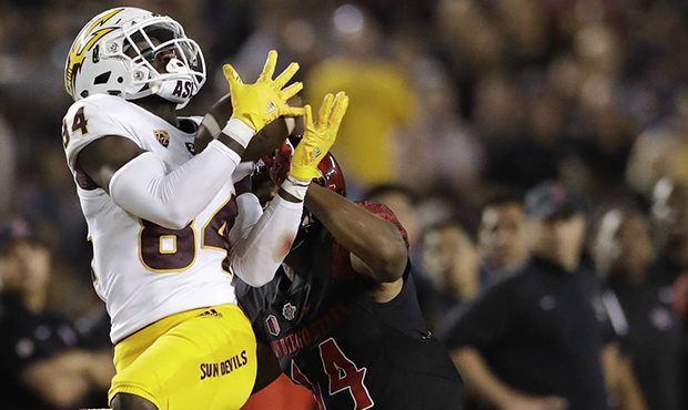 Arizona State wide receiver Frank Darby hauls in a pass as San Diego State safety Tariq Thompson de...
