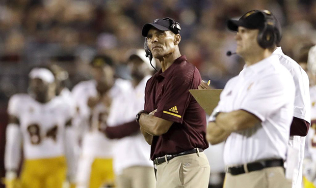 Arizona State head coach Herm Edwards, second from right, looks on during the second half of an NCA...
