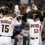 Arizona Diamondbacks first baseman Christian Walker (53) celebrates his three-run home run against the Chicago Cubs with Ildemaro Vargas (15) and Ketel Marte, back left, during the first inning of a baseball game Wednesday, Sept. 19, 2018, in Phoenix. (AP Photo/Ross D. Franklin)