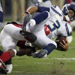 Seattle Seahawks quarterback Russell Wilson (3) is sacked by Arizona Cardinals linebacker Haason Reddick during the first half of an NFL football game, Sunday, Sept. 30, 2018, in Glendale, Ariz. (AP Photo/Ross D. Franklin)