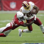 Washington Redskins running back Chris Thompson (25) is hit by Arizona Cardinals defensive back Budda Baker (36) during the first half of an NFL football game, Sunday, Sept. 9, 2018, in Glendale, Ariz. (AP Photo/Ross D. Franklin)