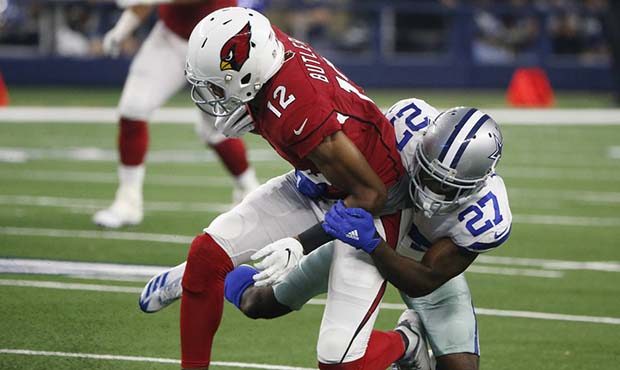 Dallas Cowboys cornerback Jourdan Lewis (27) tackles Arizona Cardinals wide receiver Brice Butler (...