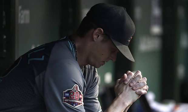 Arizona Diamondbacks starting pitcher Clay Buchholz sits in the dugout during the third inning of t...