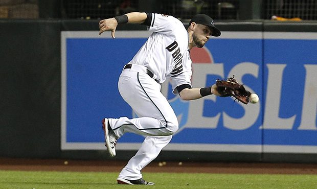 Arizona Diamondbacks' Chris Owings can not make the catch on a ball hit by Chicago Cubs' Albert Alm...