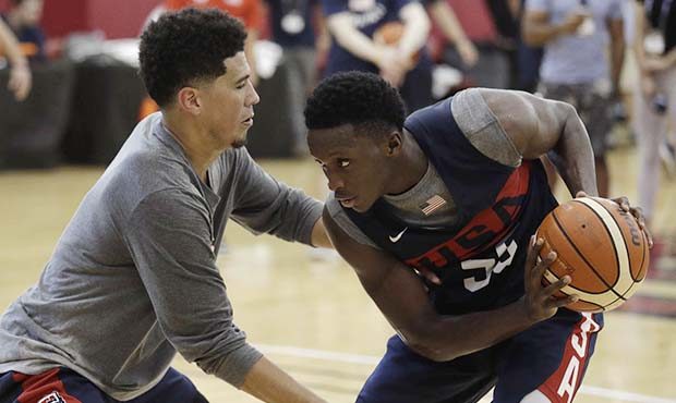 Devin Booker, left, guards Victor Oladipo during a training camp for USA Basketball, Friday, July 2...