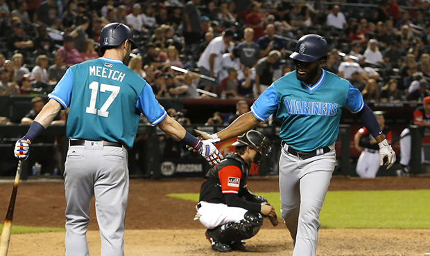 Seattle Mariners' Denard Span celebrates with Mitch Haniger (17) after hitting a solo home run agai...
