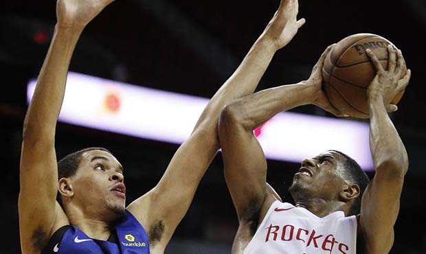 Houston Rockets' De'Anthony Melton (0) shoots over Los Angeles Clippers' Tyler Harris (28) during t...
