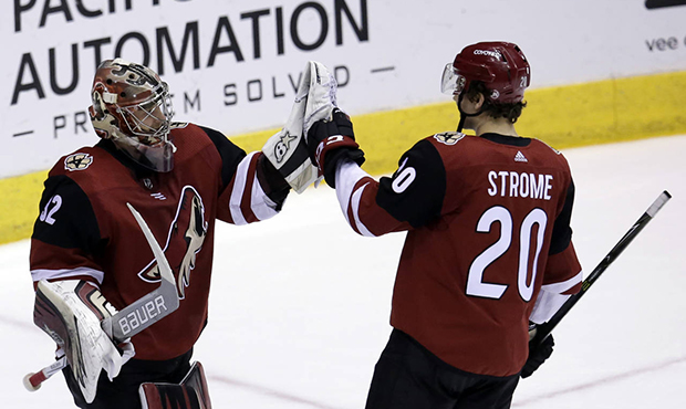 Arizona Coyotes goaltender Antti Raanta (32) celebrates with Dylan Strome (20) after shutting out t...