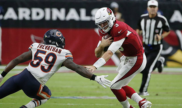 Arizona Cardinals quarterback Josh Rosen (3) tries to elude Chicago Bears linebacker Danny Trevatha...