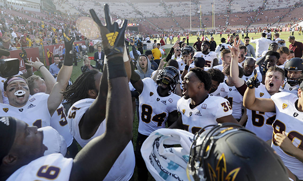 Arizona State players celebrate after a 38-35 win over Southern California during an NCAA college f...