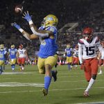 UCLA tight end Devin Asiasi, left, makes a touchdown catch as Arizona cornerback McKenzie Barnes watches during the first half of an NCAA college football game, Saturday, Oct. 20, 2018, in Pasadena, Calif. (AP Photo/Mark J. Terrill)