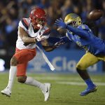 Arizona wide receiver Devaughn Cooper, left, attempts a catch as UCLA defensive back Elijah Gates knocks it down during the first half of an NCAA college football game Saturday, Oct. 20, 2018, in Pasadena, Calif. (AP Photo/Mark J. Terrill)