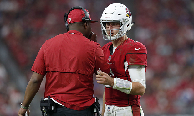 Arizona Cardinals quarterback Josh Rosen talks with offensive coordinator Byron Leftwich during the...