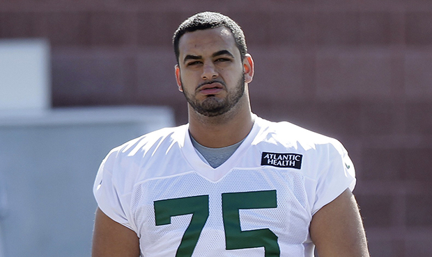 In this Thursday, July 24, 2014 file photo, New York Jets offensive tackle Oday Aboushi (75) walks ...
