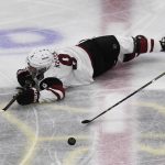 Arizona Coyotes center Clayton Keller (9) dives for the puck against the Chicago Blackhawks during the second period of an NHL hockey game Thursday, Oct. 18, 2018, in Chicago. (AP Photo/David Banks)
