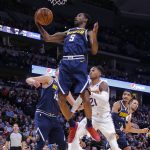 Denver Nuggets guard Will Barton (5) pulls down a rebound against the Phoenix Suns during the second quarter of an NBA basketball game, Saturday, Oct. 20, 2018, in Denver. (AP Photo/Jack Dempsey)