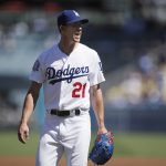Los Angeles Dodgers starting pitcher Walker Buehler shouts as he leaves the mound after the first inning of a tiebreaker baseball game against the Colorado Rockies, Monday, Oct. 1, 2018, in Los Angeles. (AP Photo/Jae C. Hong)