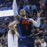 Oklahoma City Thunder guard Russell Westbrook (0) goes up for a shot in front of Phoenix Suns forward Ryan Anderson, left, in the second half of an NBA basketball game in Oklahoma City, Sunday, Oct. 28, 2018. (AP Photo/Sue Ogrocki)