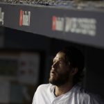 Los Angeles Dodgers starting pitcher Clayton Kershaw watches from the dugout during the seventh inning in Game 5 of the World Series baseball game against the Boston Red Sox on Sunday, Oct. 28, 2018, in Los Angeles. (AP Photo/Jae C. Hong)