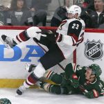 Arizona Coyotes' Oliver Ekman-Larsson, left, of Sweden, is upended in a collision with Minnesota Wild's Jared Spurgeon in the third period of an NHL hockey game, Tuesday, Oct. 16, 2018, in St. Paul, Minn. The Wild won 2-1. (AP Photo/Jim Mone)
