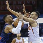Oklahoma City Thunder guard Russell Westbrook, left, loses control of the ball after a foul by Phoenix Suns guard Elie Okobo, right, in the second half of an NBA basketball game in Oklahoma City, Sunday, Oct. 28, 2018. (AP Photo/Sue Ogrocki)
