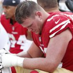 San Francisco 49ers offensive tackle Mike McGlinchey sits on the bench during the second half of an NFL football game against the Arizona Cardinals in Santa Clara, Calif., Sunday, Oct. 7, 2018. (AP Photo/Tony Avelar)