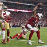 Arizona Cardinals wide receiver Larry Fitzgerald (11) celebrates his two point conversion as San Francisco 49ers defensive back K'Waun Williams (24) defends during the second half of an NFL football game, Sunday, Oct. 28, 2018, in Glendale, Ariz. The Cardinals won 18-15. (AP Photo/Ralph Freso)