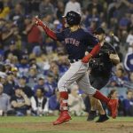 Boston Red Sox's Mookie Betts celebrates after hitting a solo home run against Los Angeles Dodgers' Clayton Kershaw during the sixth inning in Game 5 of the World Series baseball game on Sunday, Oct. 28, 2018, in Los Angeles. (AP Photo/David J. Phillip)