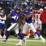 Minnesota Vikings defensive back Anthony Harris (41) celebrates with teammate Eric Kendricks after intercepting a pass during the second half of an NFL football game against the Arizona Cardinals, Sunday, Oct. 14, 2018, in Minneapolis. (AP Photo/Bruce Kluckhohn)