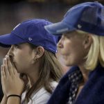 Los Angeles Dodgers fans watch during the eighth inning in Game 5 of the World Series baseball game against the Boston Red Sox on Sunday, Oct. 28, 2018, in Los Angeles. (AP Photo/Jae C. Hong)