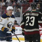 Buffalo Sabres left wing Evan Rodrigues (71) yells at Arizona Coyotes defenseman Oliver Ekman-Larsson after getting slashed during the third period during an NHL hockey game Saturday, Oct. 13, 2018, in Glendale, Ariz. (AP Photo/Rick Scuteri)
